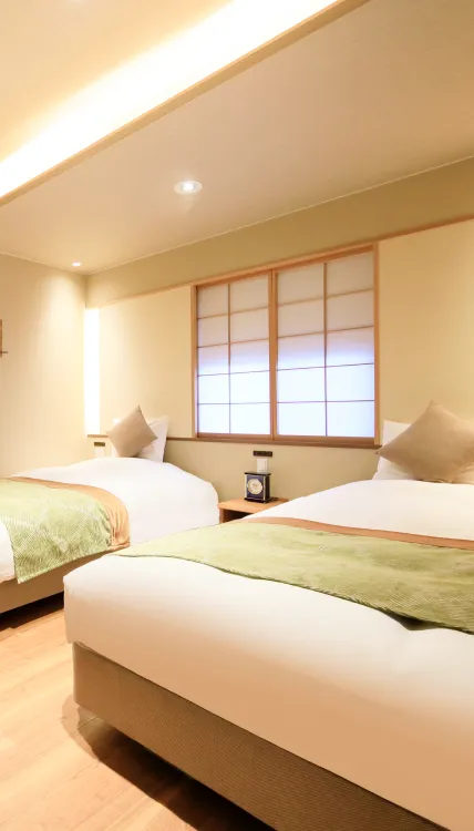 広々とした客室のベッドルーム